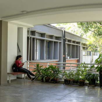 Student Sitting in the Viewing Corridor of the School of Chemical Engineering