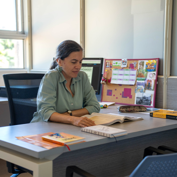 Group member reading in the office.