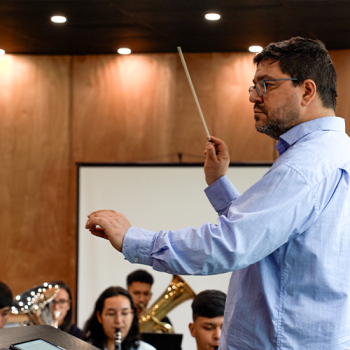 Conductor Leading an Orchestra Rehearsal